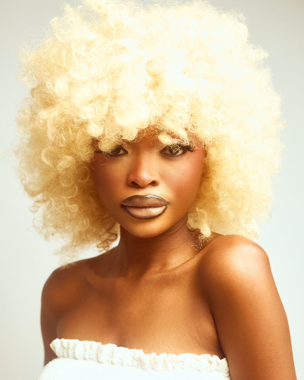 Editorial studio portrait, platinum afro